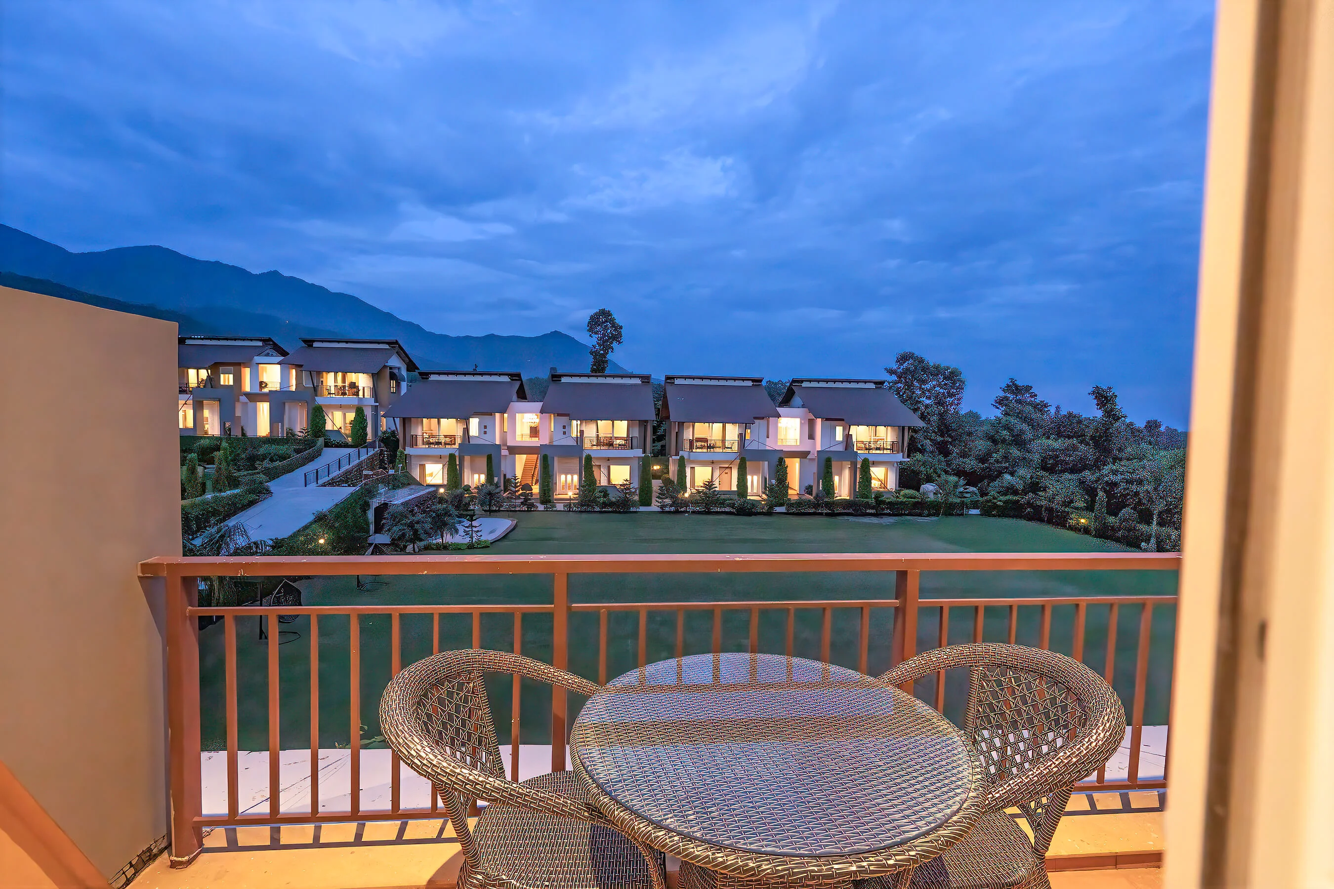 Deluxe Room at Evara Spa & Resort with king bed and private balcony