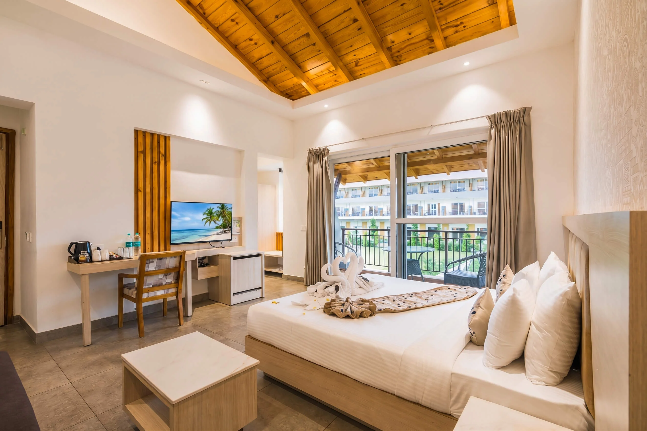 Super Deluxe Cottage at Evara Resort opening onto the lawn